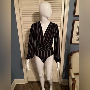 Takara long sleeve bodysuit, black, white, and gray striped. Medium